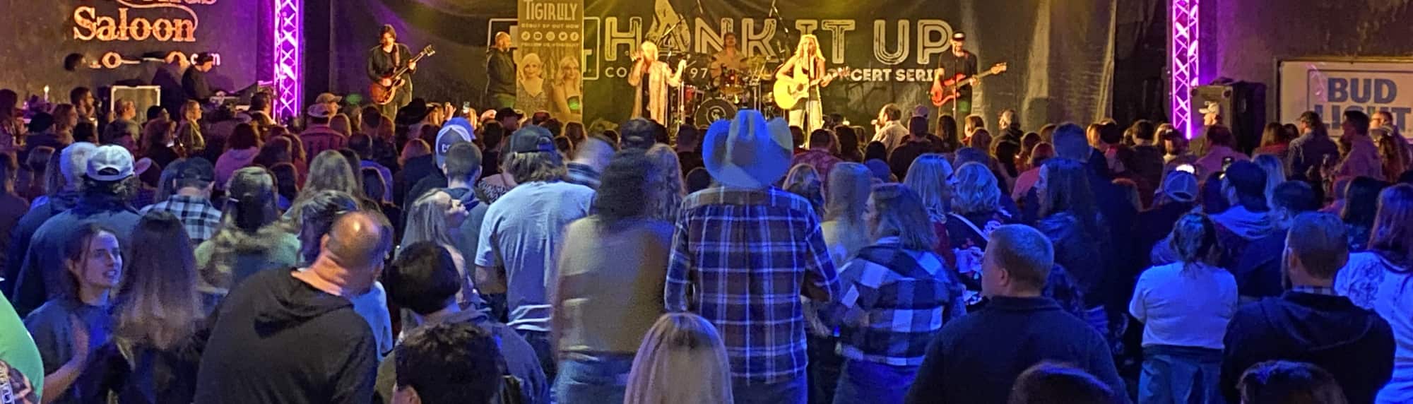 country concert with fans wearing cowboy hats Waco