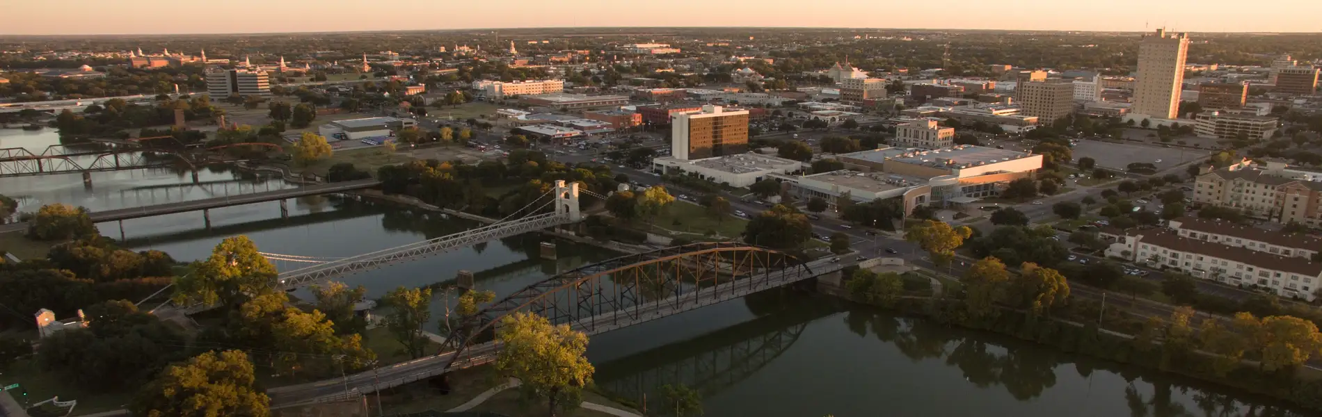 Neon color image of a band playing and people singing along