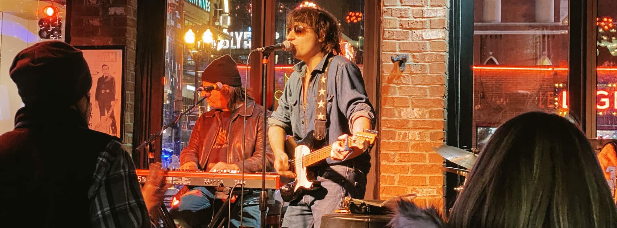 bar singer on guitar in Waco